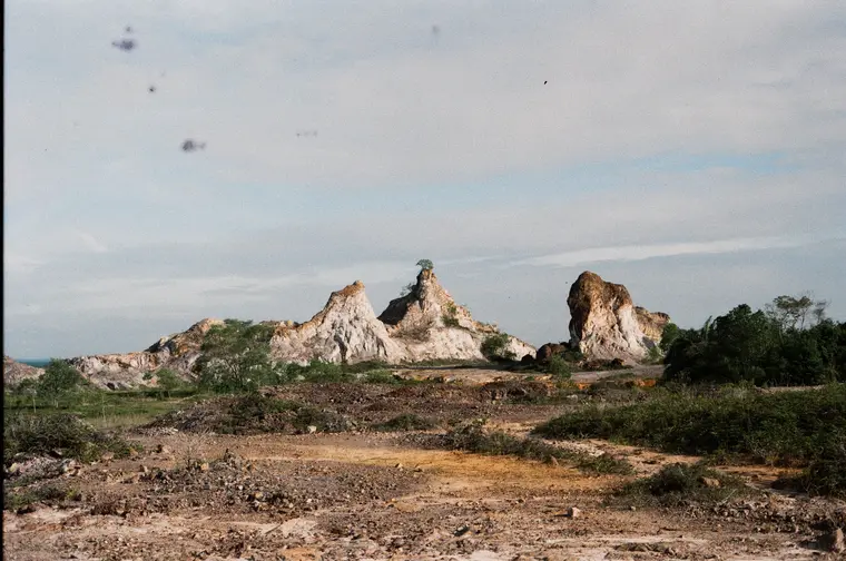 Rock spires rising above scrub at Sepang South Africa, shot on Kodak ColorPlus 200