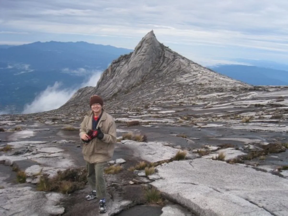 Ks Du at the summit of Mount Kinabalu — the photo that inspired Kay Du's journey