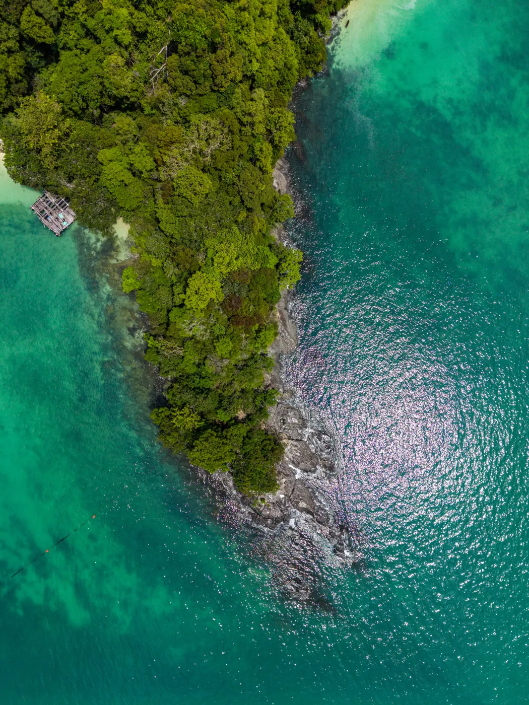 Turquoise lagoon and limestone cliffs in Langkawi