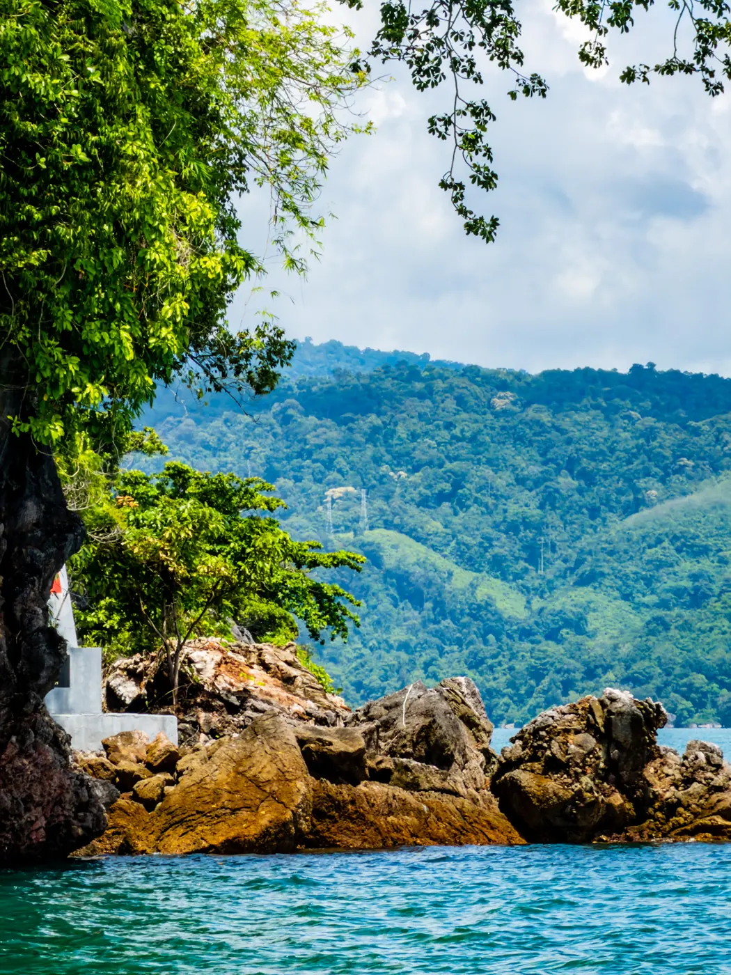 Limestone islands rising from turquoise water in Langkawi