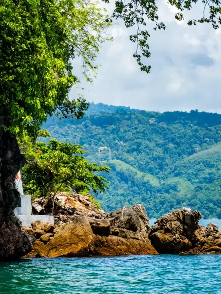 Limestone islands rising from turquoise water in Langkawi