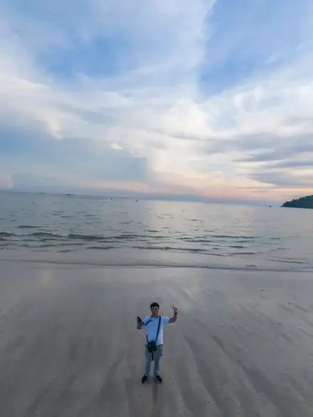 Group on the white sand beach of Pulau Beras Basah