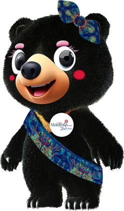Visit Malaysia 2026 Malayan sun bear mascot wearing a songket shawl and ribbon